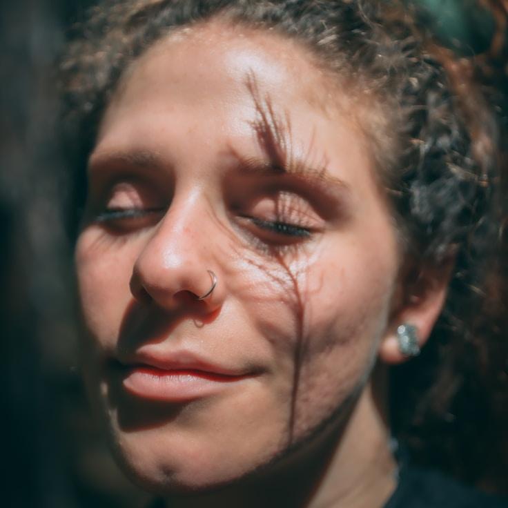 Ari Sharma, Lead Design Curator at SierraCottageVault, reviewing corporate floral arrangements